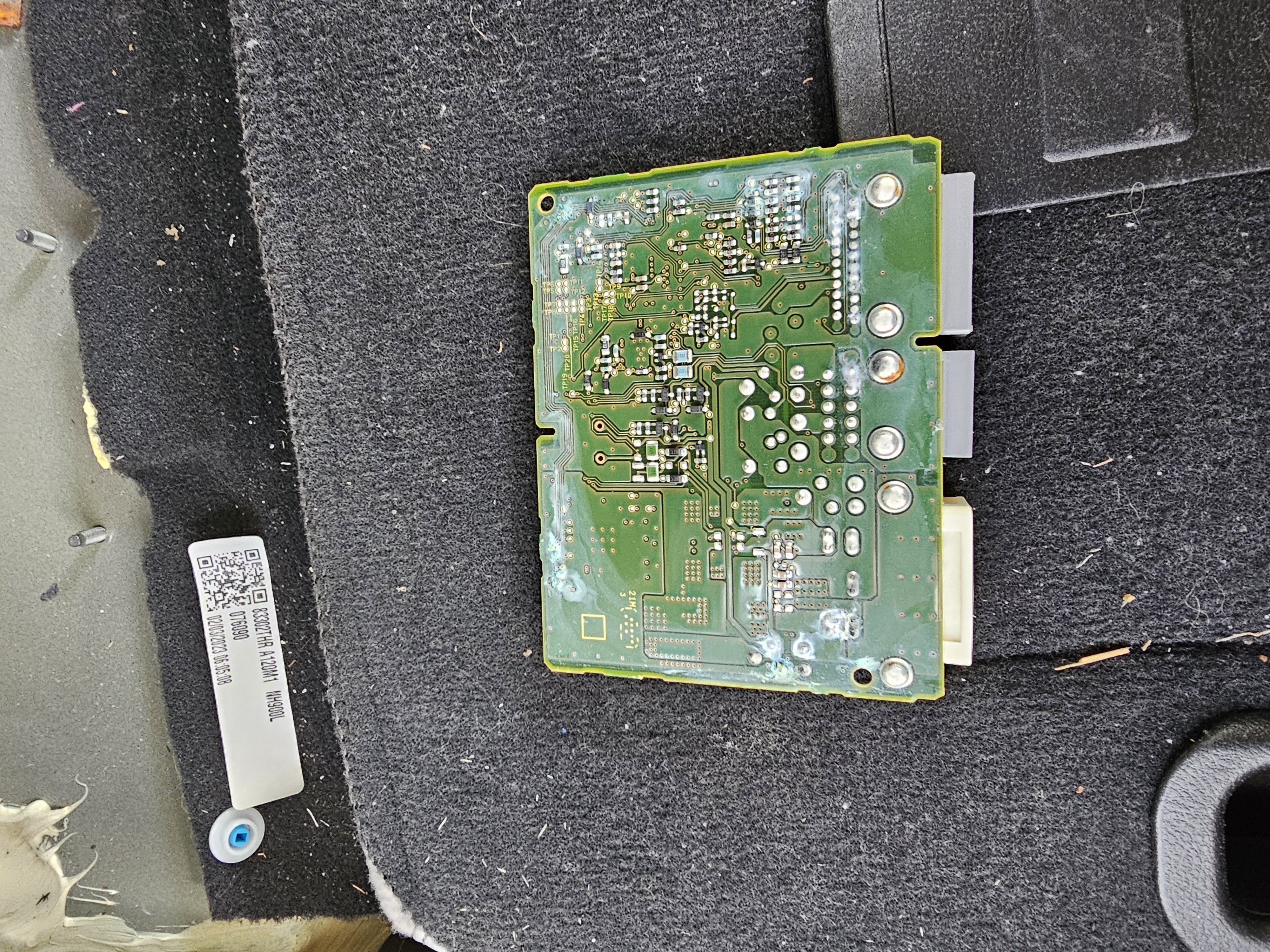 Circuit board showing green corrosion and water damage